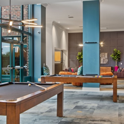 a clubroom with pool tables