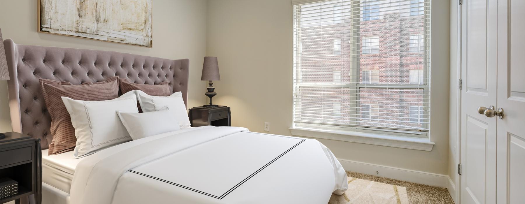 a bedroom with a large window
