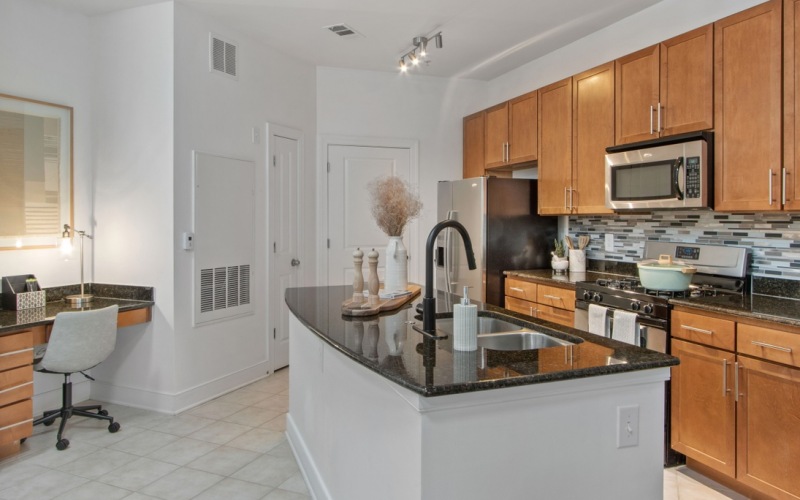 a kitchen with wooden cabinets